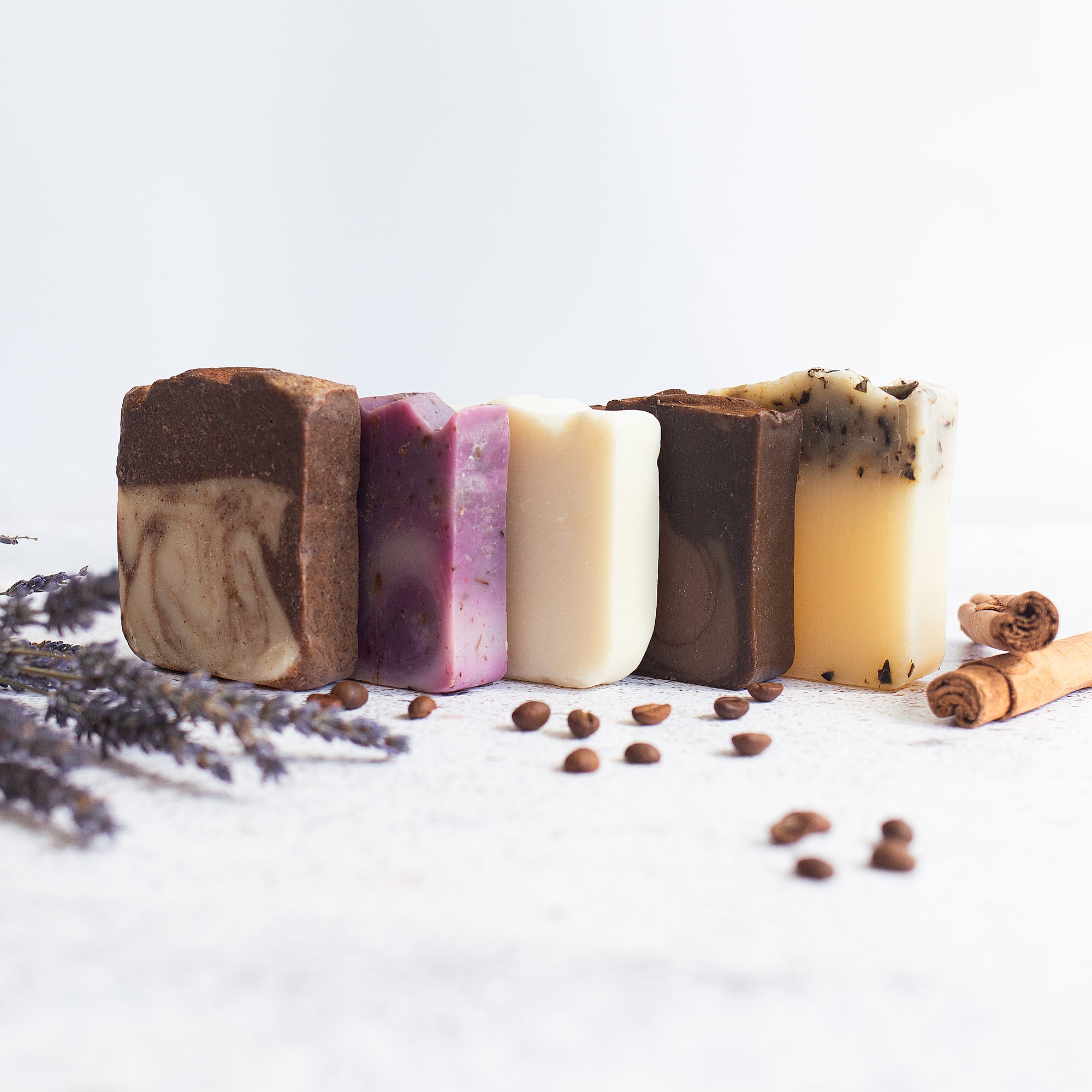 Handmade Soaps Collection.- Lifestyle image next to natural ingredients
