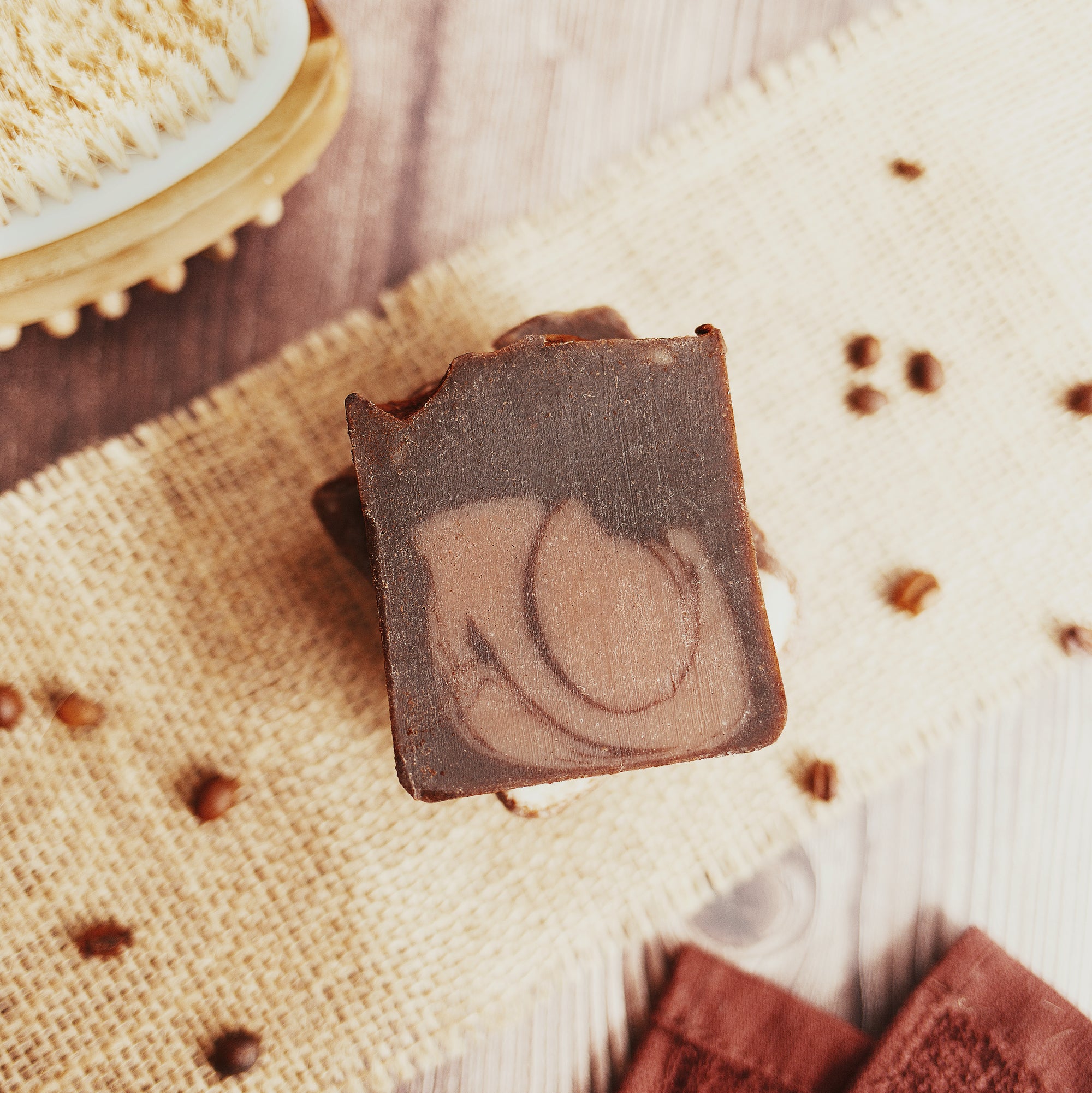 Arabica Coffee Soap - Lifestyle with coffee beans on mesh cover